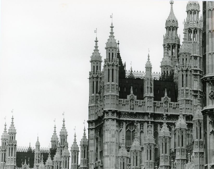 Detailed black and white photo of Gothic architecture at a famous London landmark.